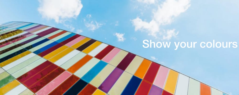 Typocolor case study cover photo of a colourful glass building